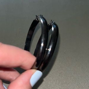 Black chrome silver hoop earrings.